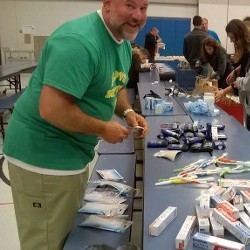 Man Giving Out Toiletries