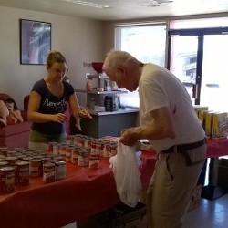 Volunteer Giving Client Canned Goods