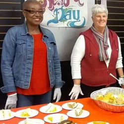 Women Giving Out Food